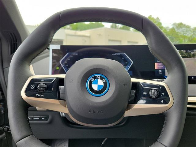 new 2024 BMW iX car, priced at $95,595