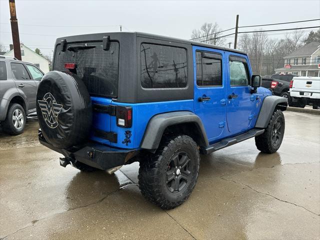 used 2015 Jeep Wrangler Unlimited car, priced at $16,995