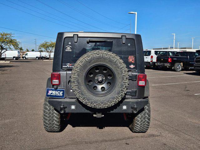 used 2014 Jeep Wrangler Unlimited car, priced at $17,991