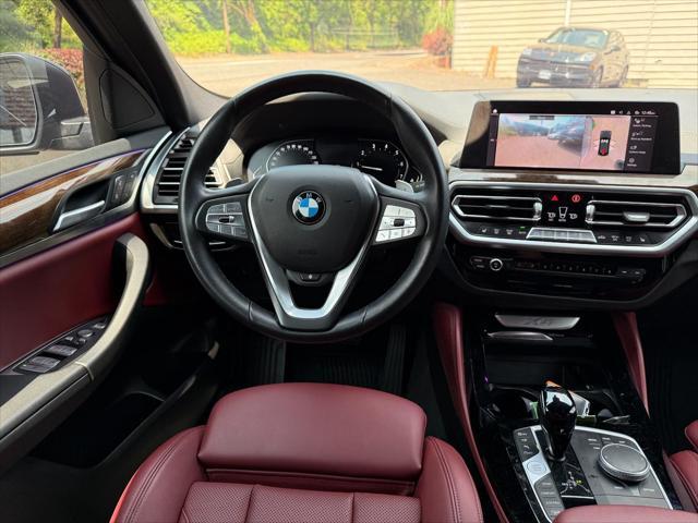 used 2022 BMW X4 car, priced at $38,995