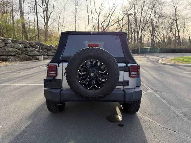 used 2014 Jeep Wrangler Unlimited car, priced at $16,995