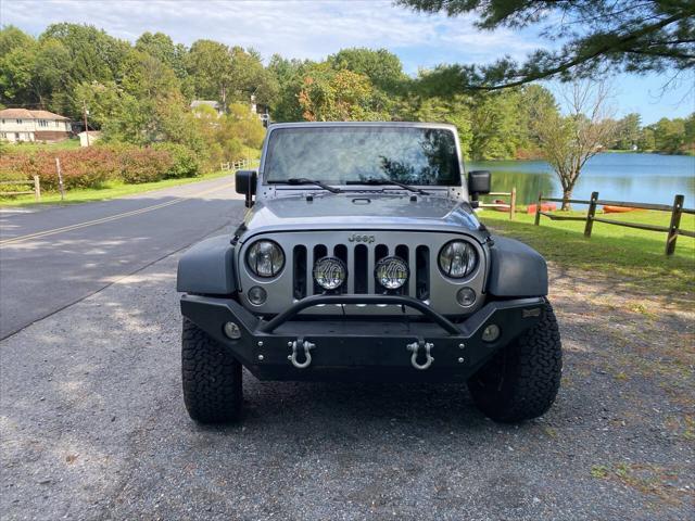 used 2014 Jeep Wrangler Unlimited car, priced at $21,995