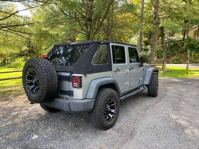 used 2014 Jeep Wrangler Unlimited car, priced at $21,995