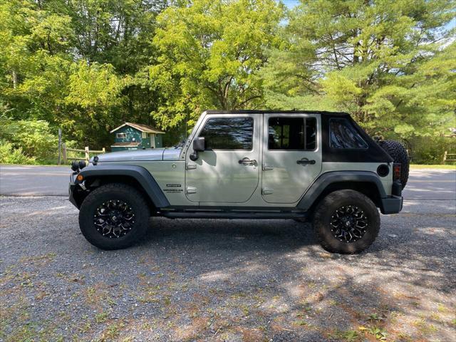 used 2014 Jeep Wrangler Unlimited car, priced at $21,995