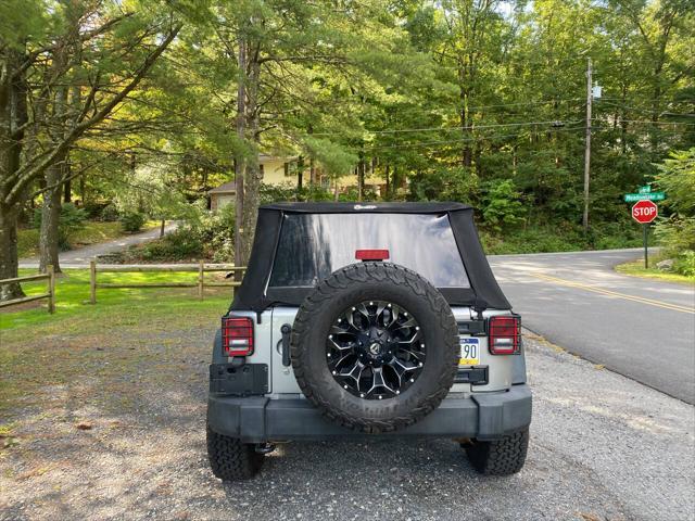 used 2014 Jeep Wrangler Unlimited car, priced at $21,995