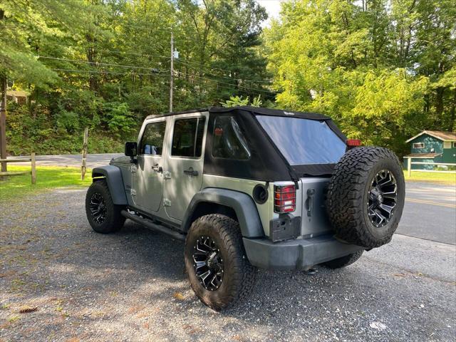 used 2014 Jeep Wrangler Unlimited car, priced at $21,995