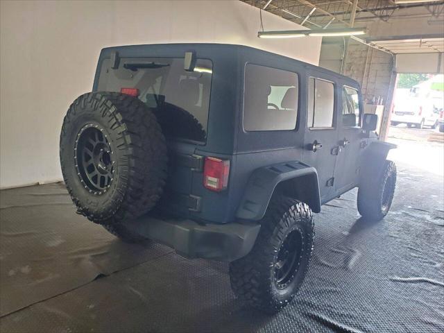 used 2013 Jeep Wrangler Unlimited car, priced at $15,499