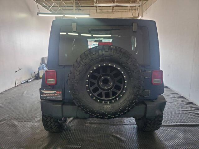 used 2013 Jeep Wrangler Unlimited car, priced at $15,499