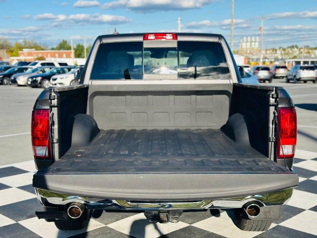 used 2018 Ram 1500 car, priced at $24,698