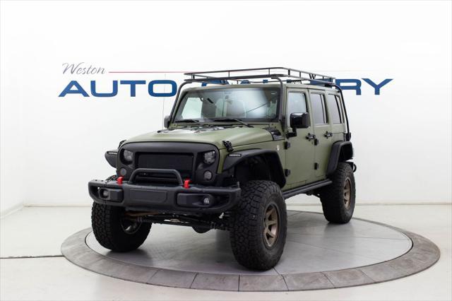 used 2013 Jeep Wrangler Unlimited car, priced at $30,980