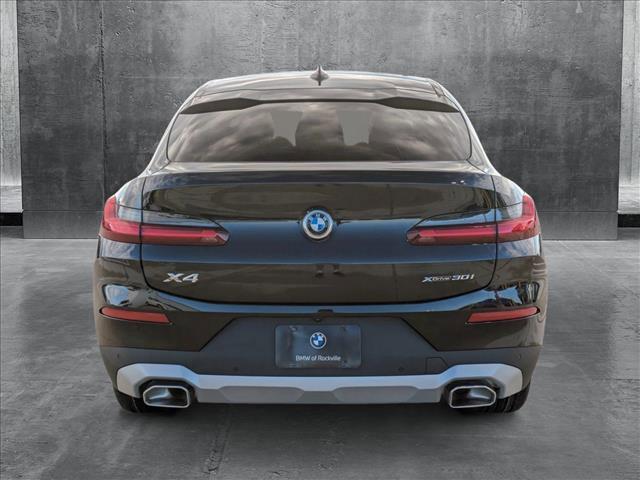 used 2025 BMW X4 car, priced at $56,971