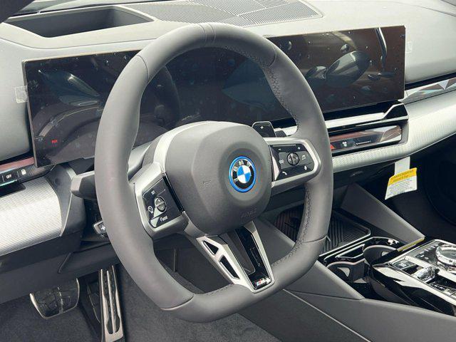 new 2025 BMW 550e car, priced at $86,325