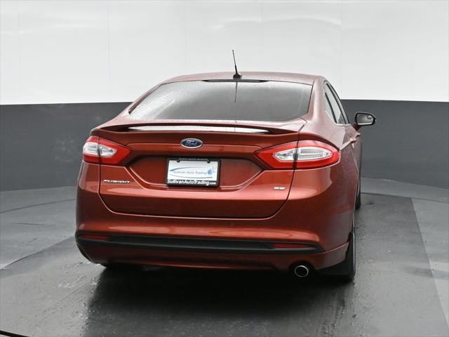 used 2014 Ford Fusion car, priced at $9,999