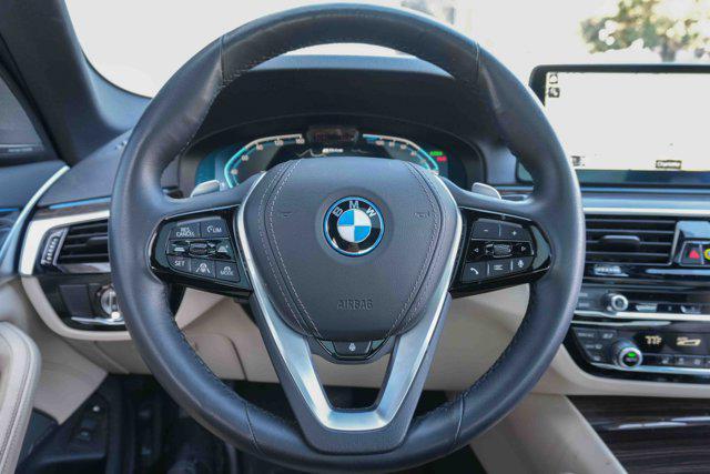used 2023 BMW 530e car, priced at $37,319