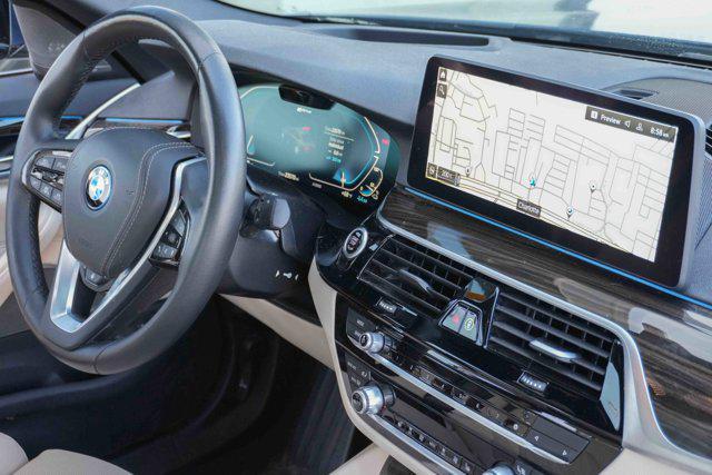 used 2023 BMW 530e car, priced at $37,319