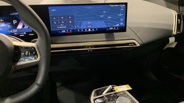 new 2026 BMW iX car, priced at $97,870