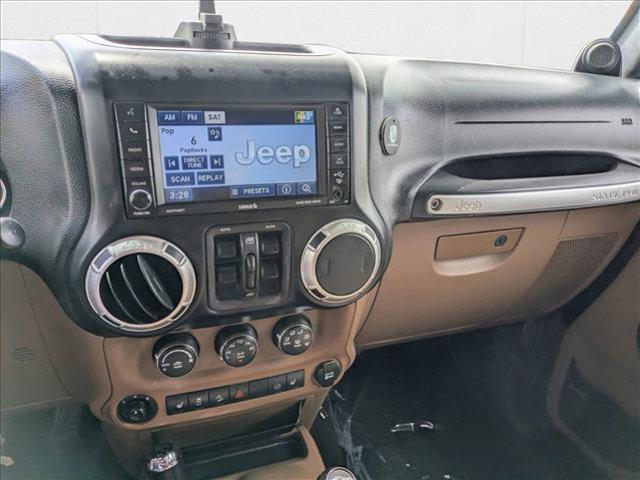 used 2012 Jeep Wrangler Unlimited car, priced at $16,509