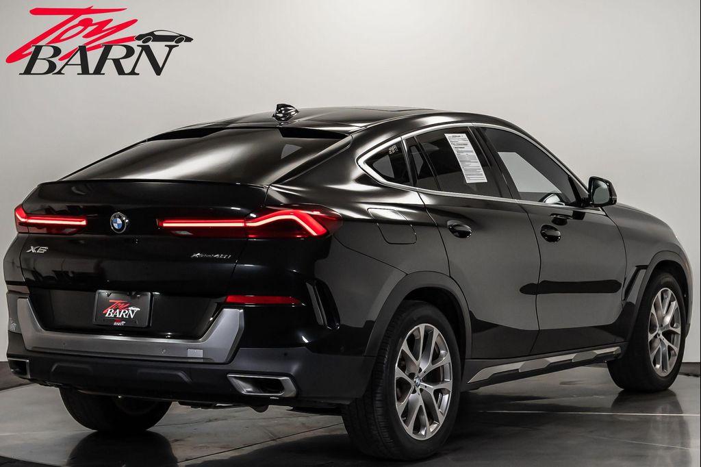 used 2023 BMW X6 car, priced at $57,490