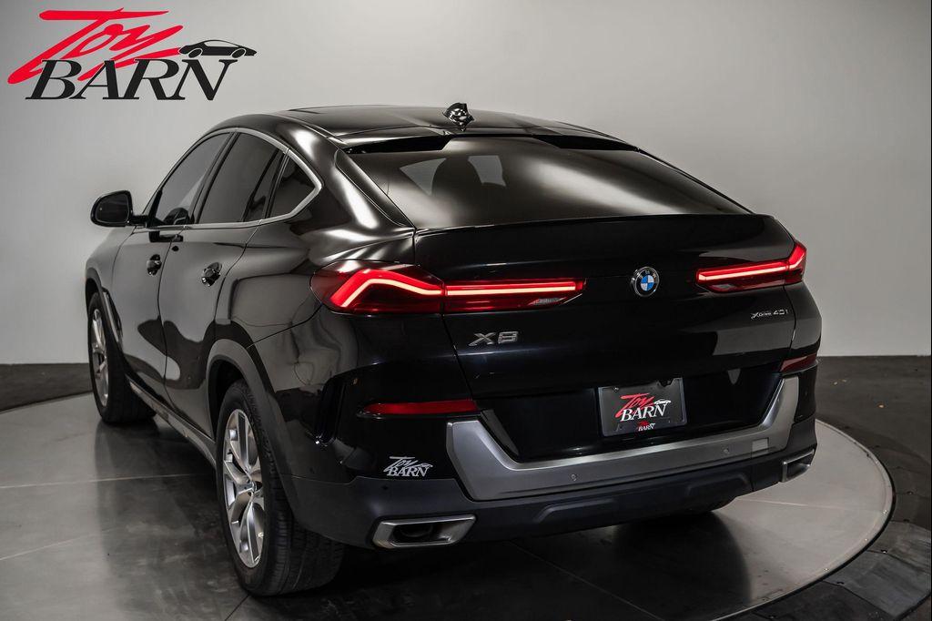 used 2023 BMW X6 car, priced at $57,490