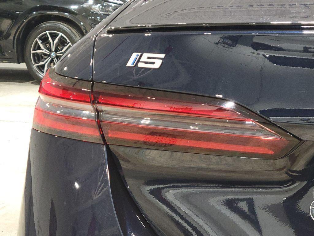 used 2024 BMW i5 car, priced at $58,894