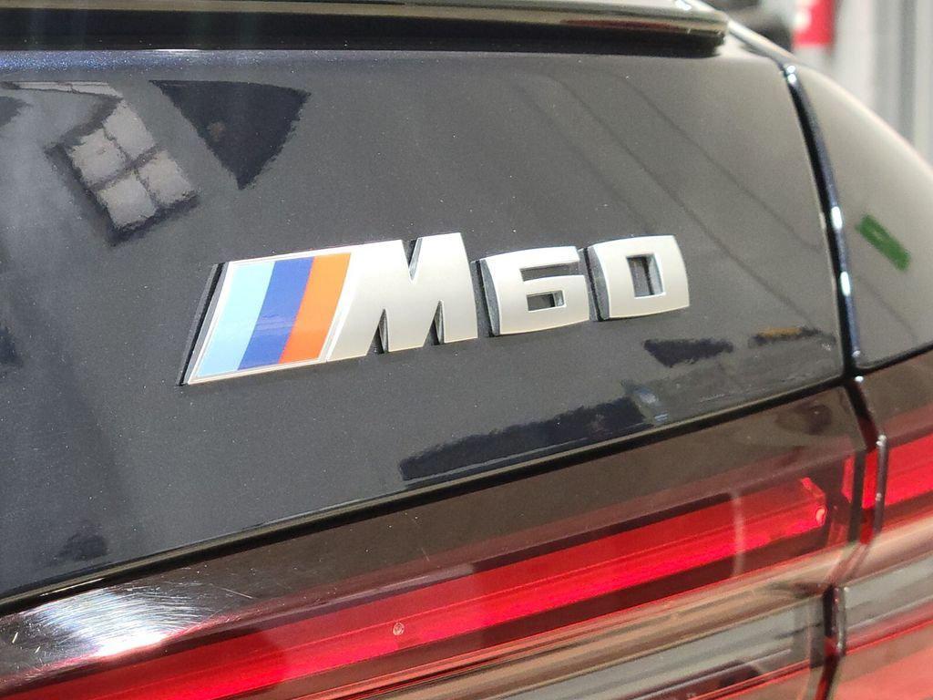 used 2024 BMW i5 car, priced at $58,894