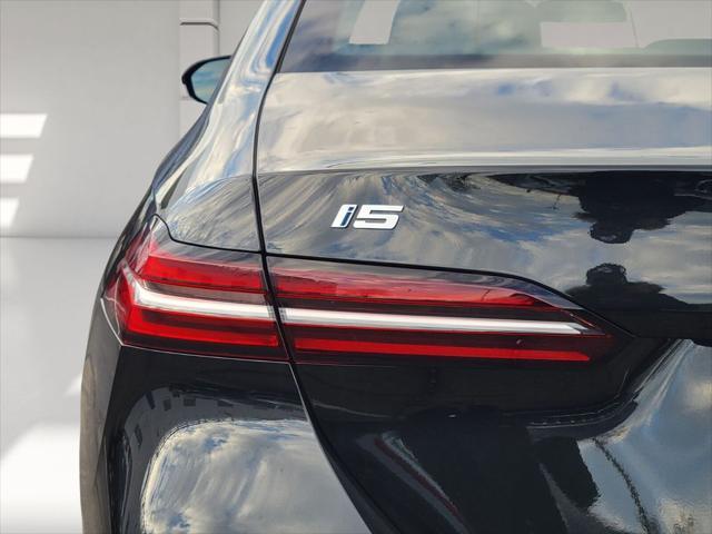 used 2025 BMW i5 car, priced at $65,670
