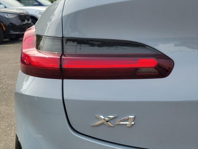 used 2025 BMW X4 car, priced at $64,910