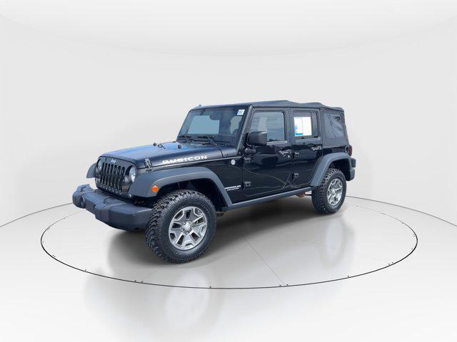 used 2014 Jeep Wrangler Unlimited car, priced at $23,297
