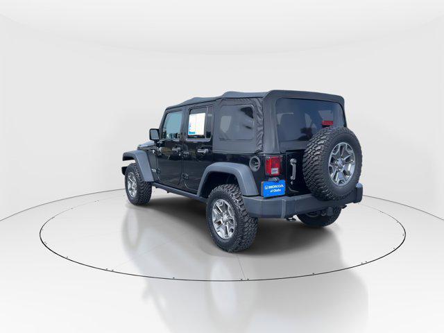 used 2014 Jeep Wrangler Unlimited car, priced at $23,297