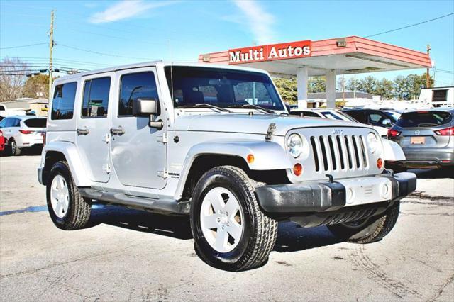 used 2011 Jeep Wrangler Unlimited car, priced at $23,995