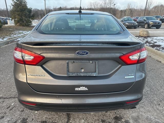 used 2014 Ford Fusion car, priced at $6,997