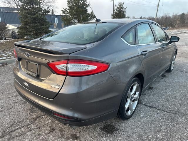 used 2014 Ford Fusion car, priced at $6,997