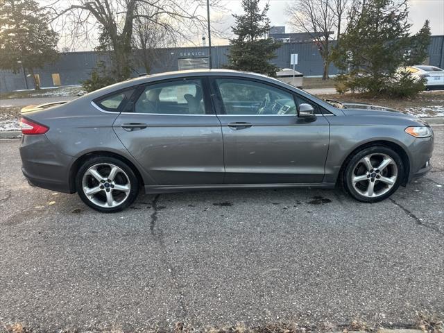 used 2014 Ford Fusion car, priced at $6,997