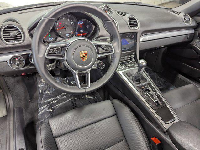 new 2025 Porsche 718 Boxster car, priced at $100,000
