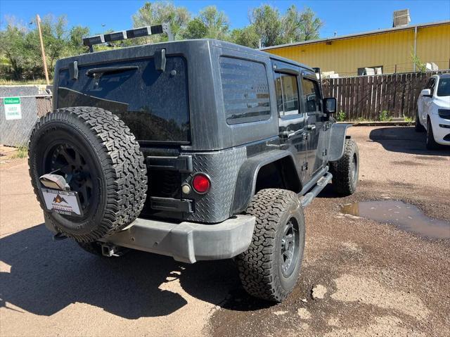 used 2011 Jeep Wrangler Unlimited car, priced at $17,792