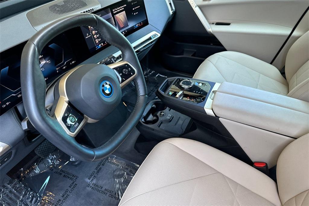 used 2024 BMW iX car, priced at $61,988