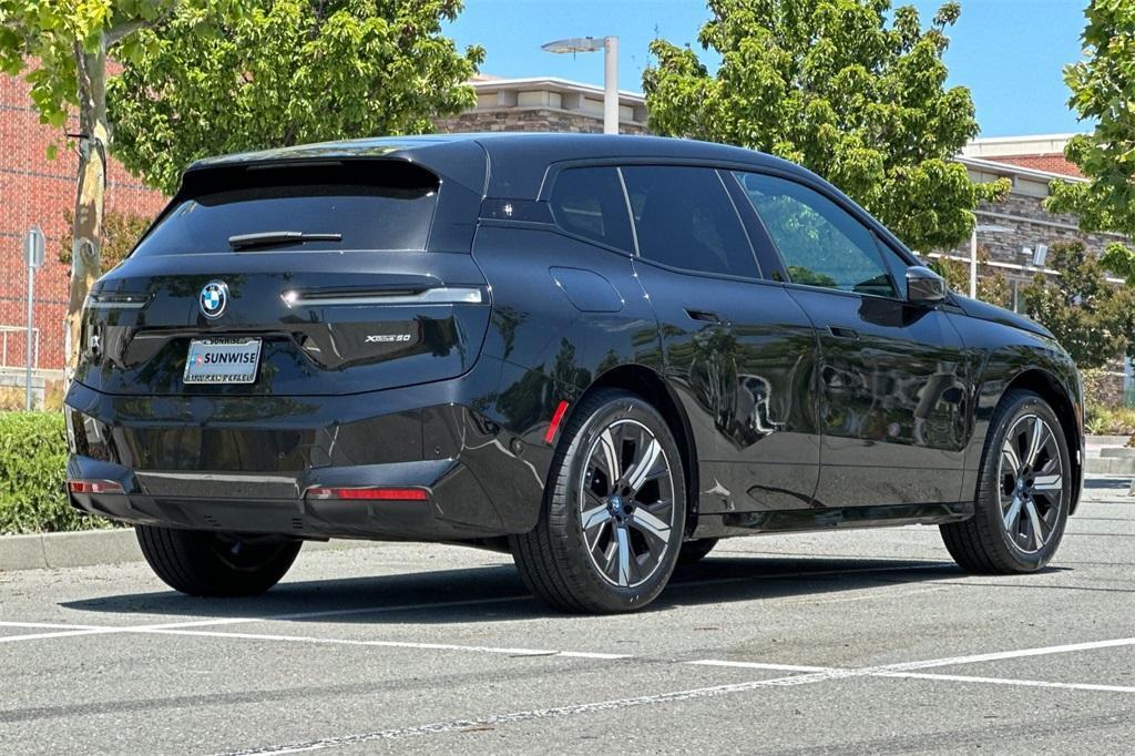 used 2024 BMW iX car, priced at $61,988