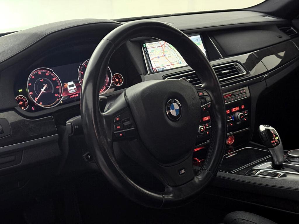 used 2015 BMW 740 car, priced at $13,900