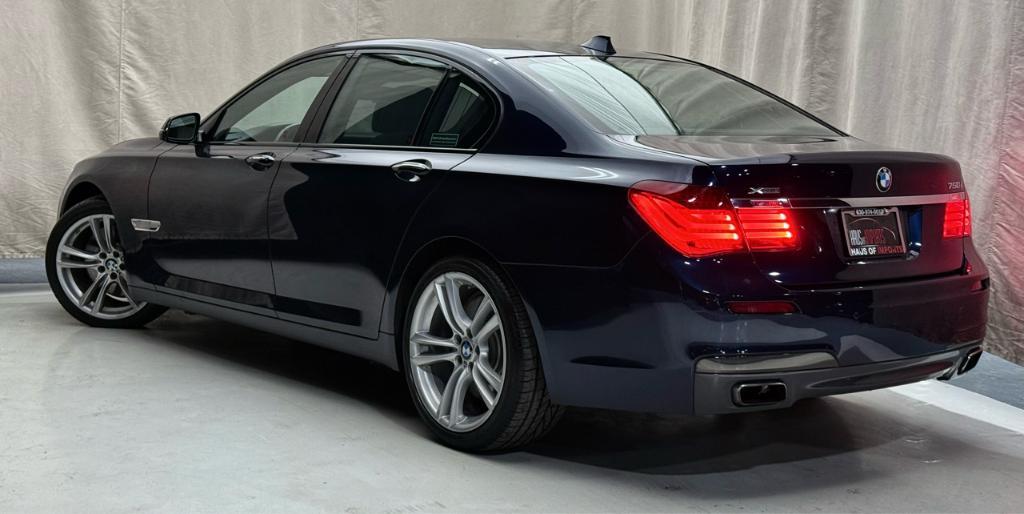 used 2015 BMW 750 car, priced at $18,900