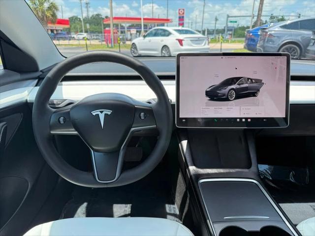 used 2023 Tesla Model 3 car, priced at $27,691