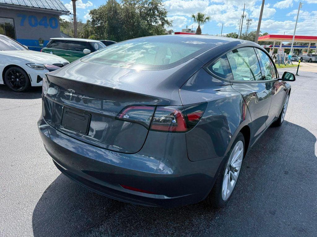 used 2023 Tesla Model 3 car, priced at $27,691