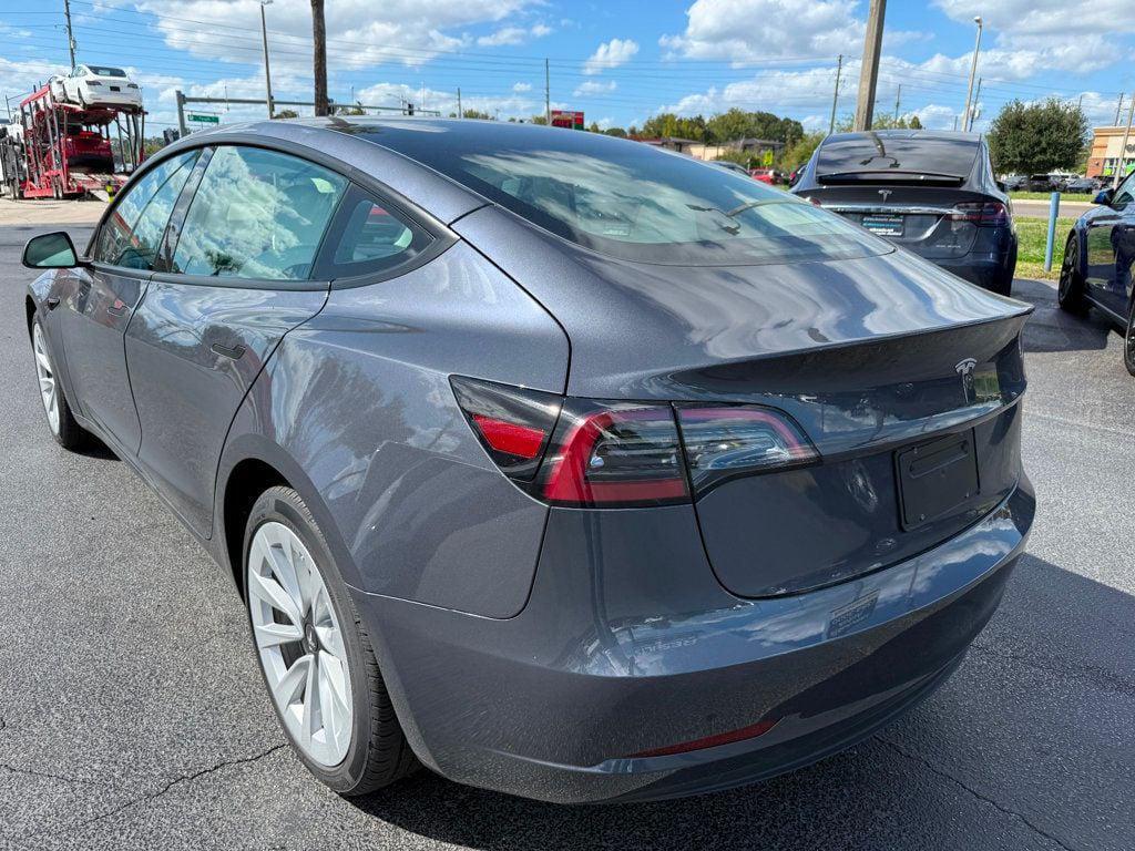used 2023 Tesla Model 3 car, priced at $27,691