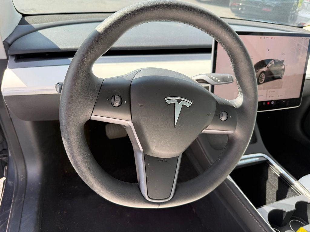 used 2023 Tesla Model 3 car, priced at $27,691