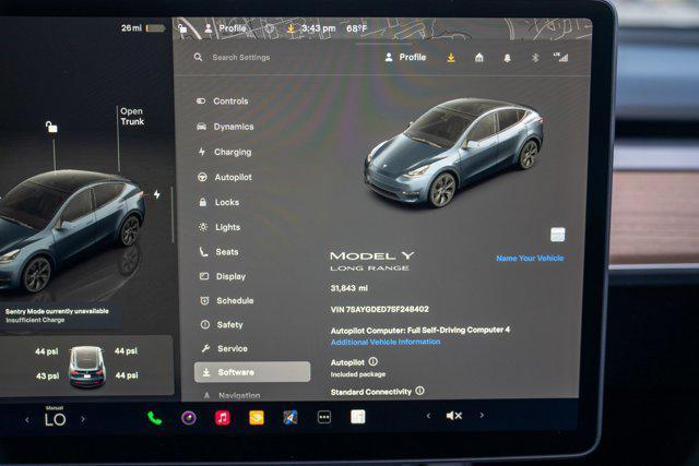 used 2025 Tesla Model Y car, priced at $34,995