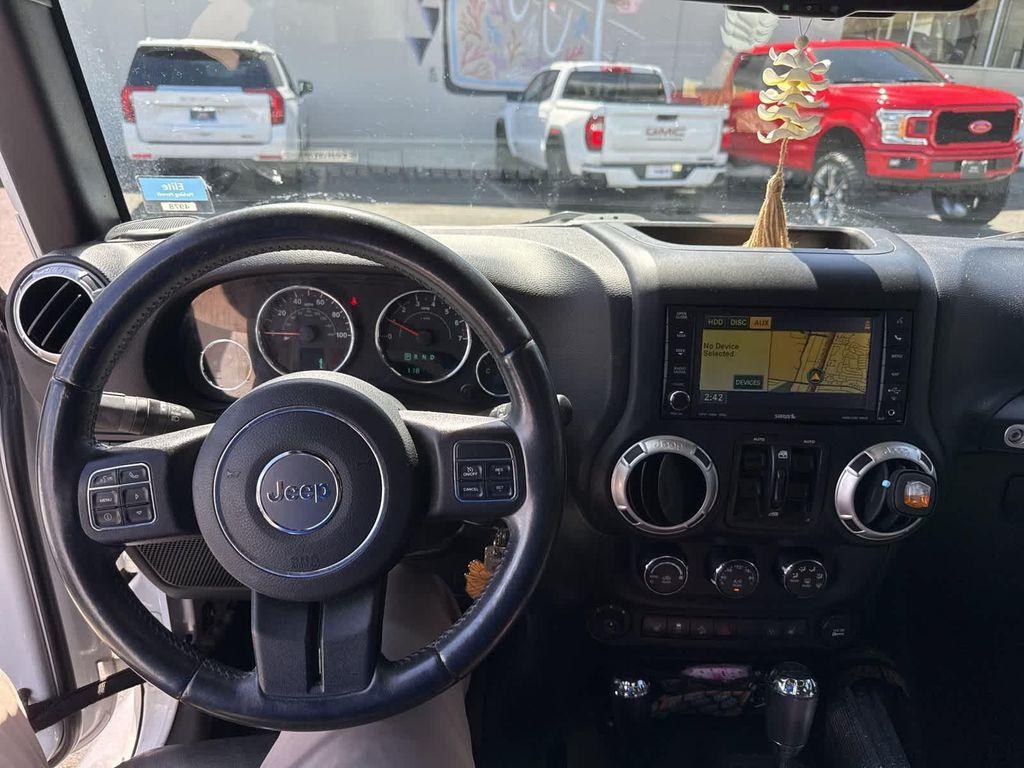 used 2015 Jeep Wrangler Unlimited car, priced at $19,729