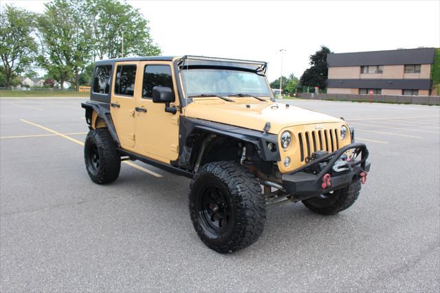 used 2014 Jeep Wrangler Unlimited car, priced at $17,900