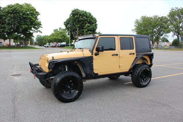 used 2014 Jeep Wrangler Unlimited car, priced at $17,900