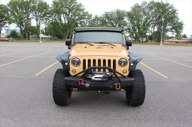 used 2014 Jeep Wrangler Unlimited car, priced at $17,900