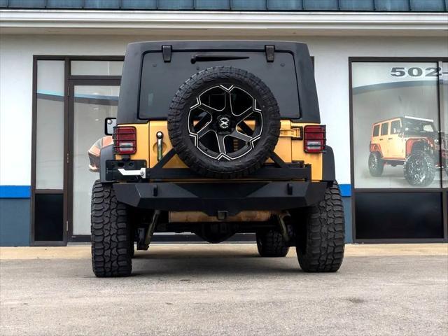 used 2014 Jeep Wrangler Unlimited car, priced at $18,444
