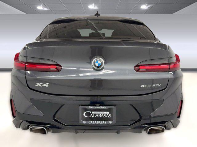 used 2023 BMW X4 car, priced at $41,397